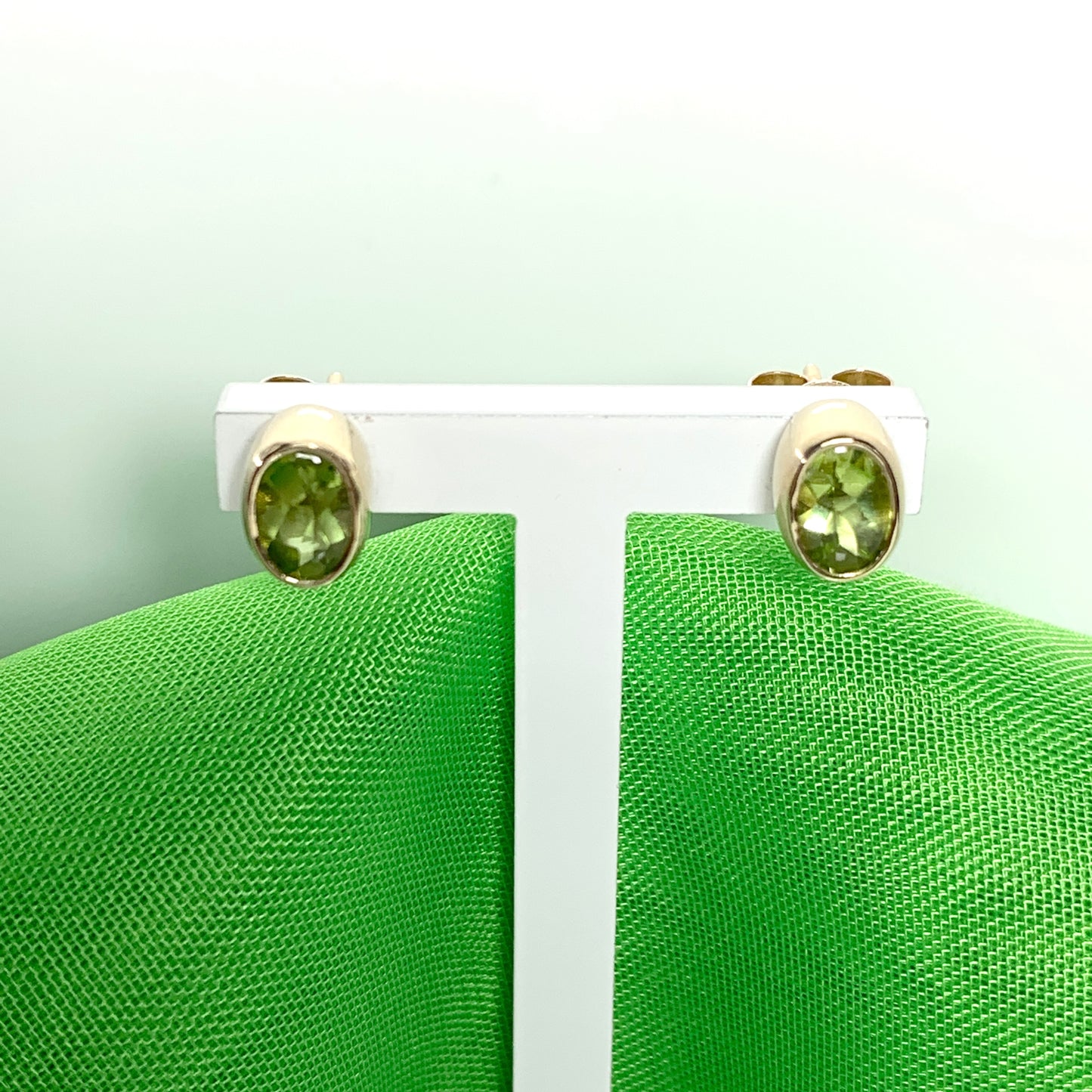 Oval Shaped Peridot Yellow Gold Stud Earrings