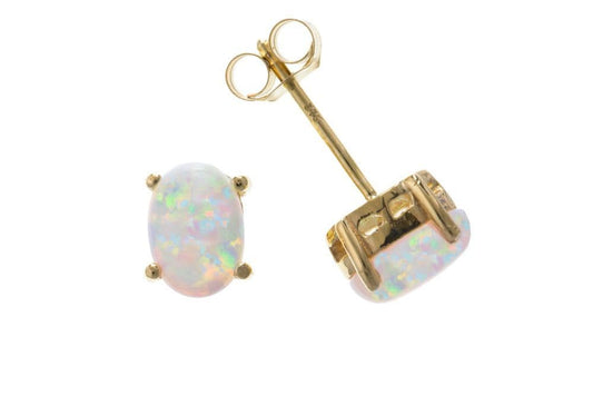 Oval yellow gold opal stud earrings