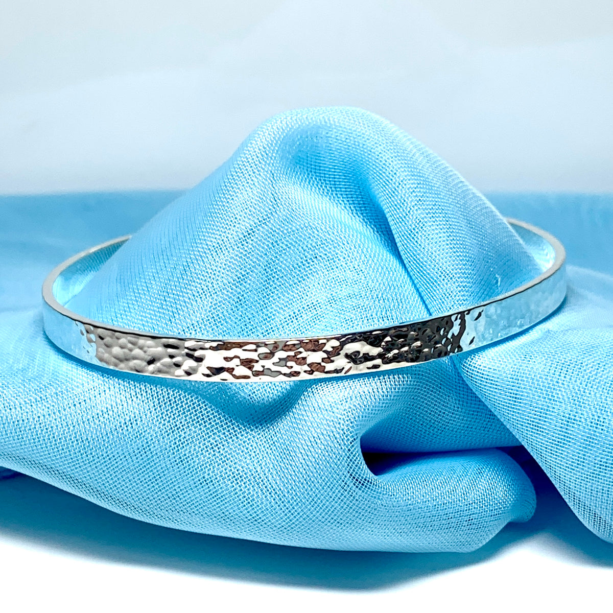 Oval shaped bangle hammered patterned solid sterling silver