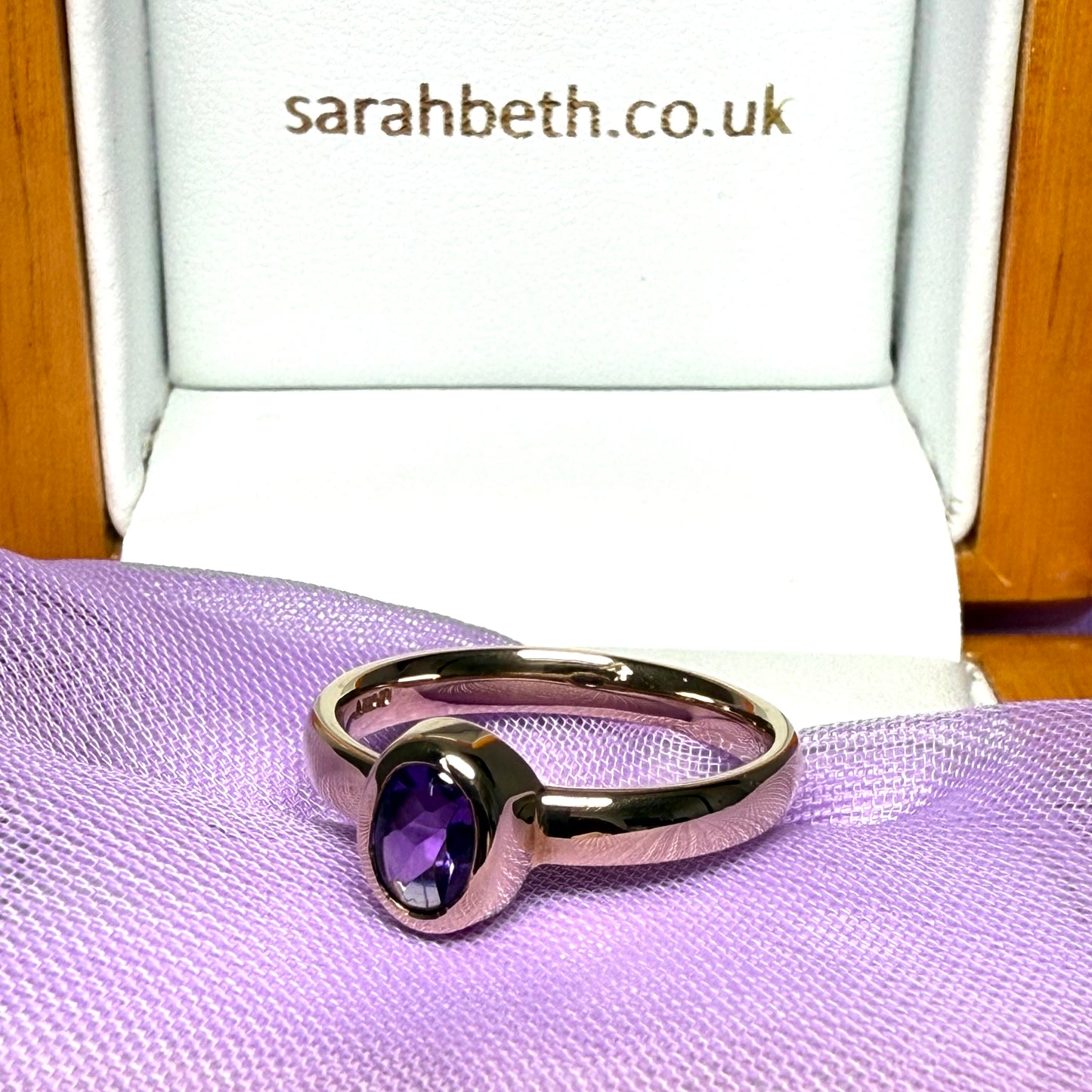 Oval shaped real amethyst dress ring yellow gold