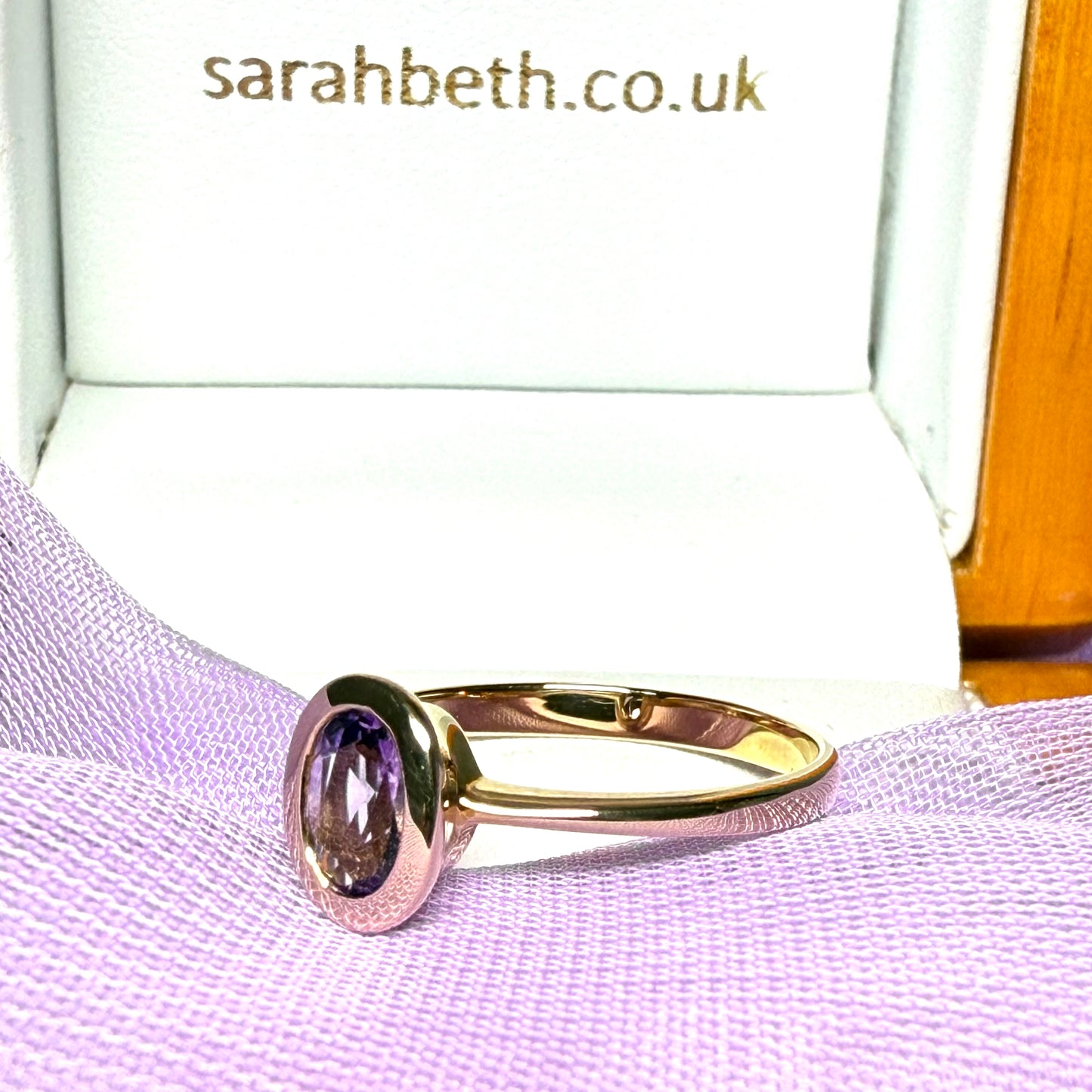 Oval shaped real amethyst yellow gold dress ring