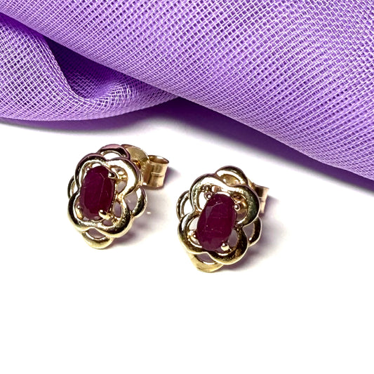 Oval shaped real ruby yellow gold stud earrings