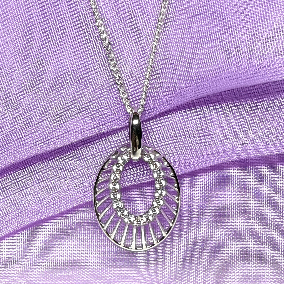 Oval shaped cubic zirconia sterling silver necklace with a chain