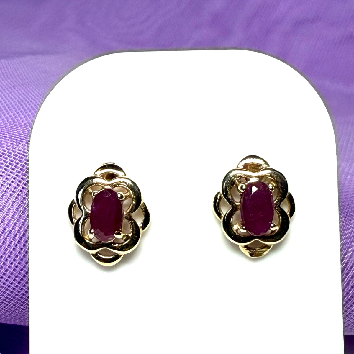 Oval shaped real ruby yellow gold stud earrings