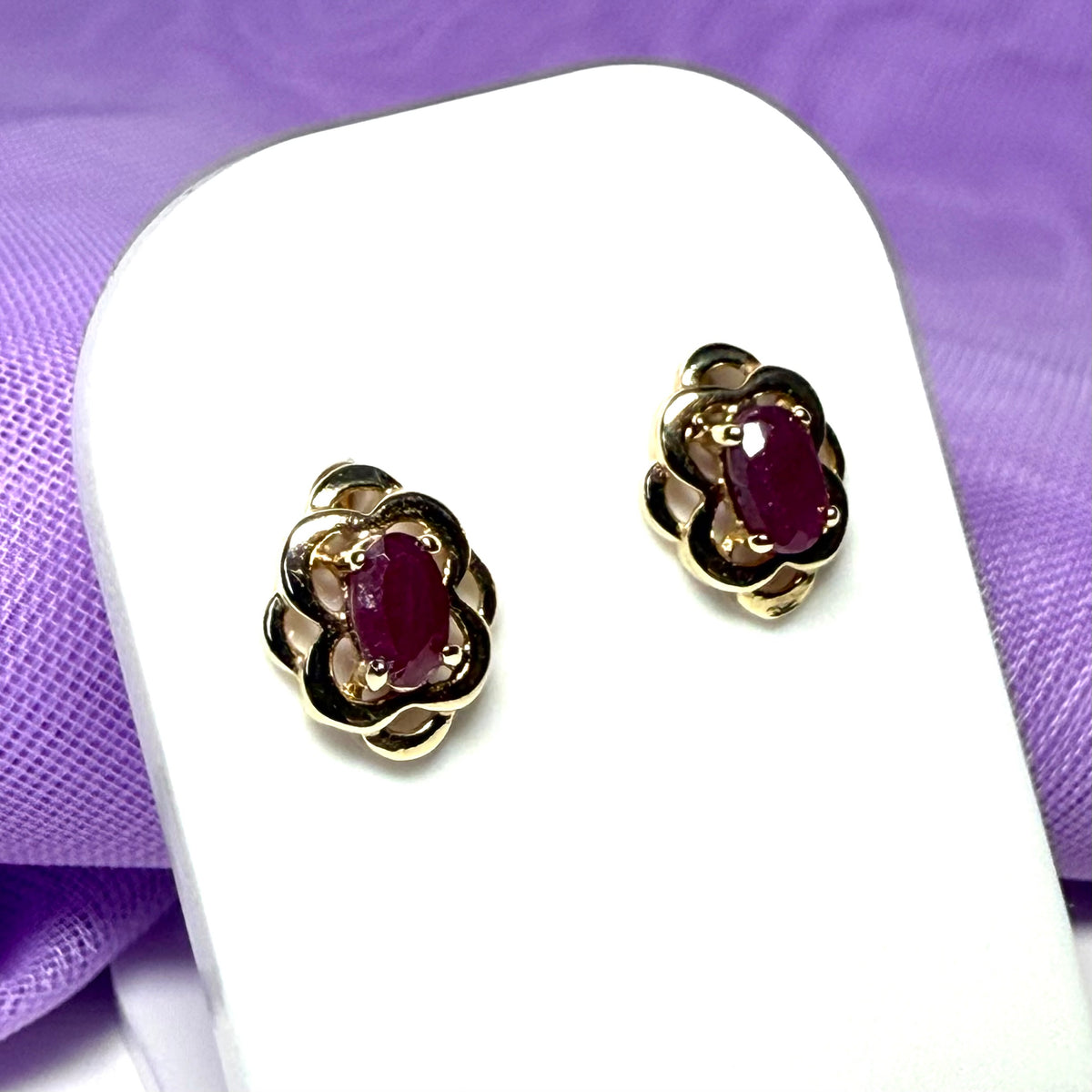 Oval shaped real ruby yellow gold stud earrings