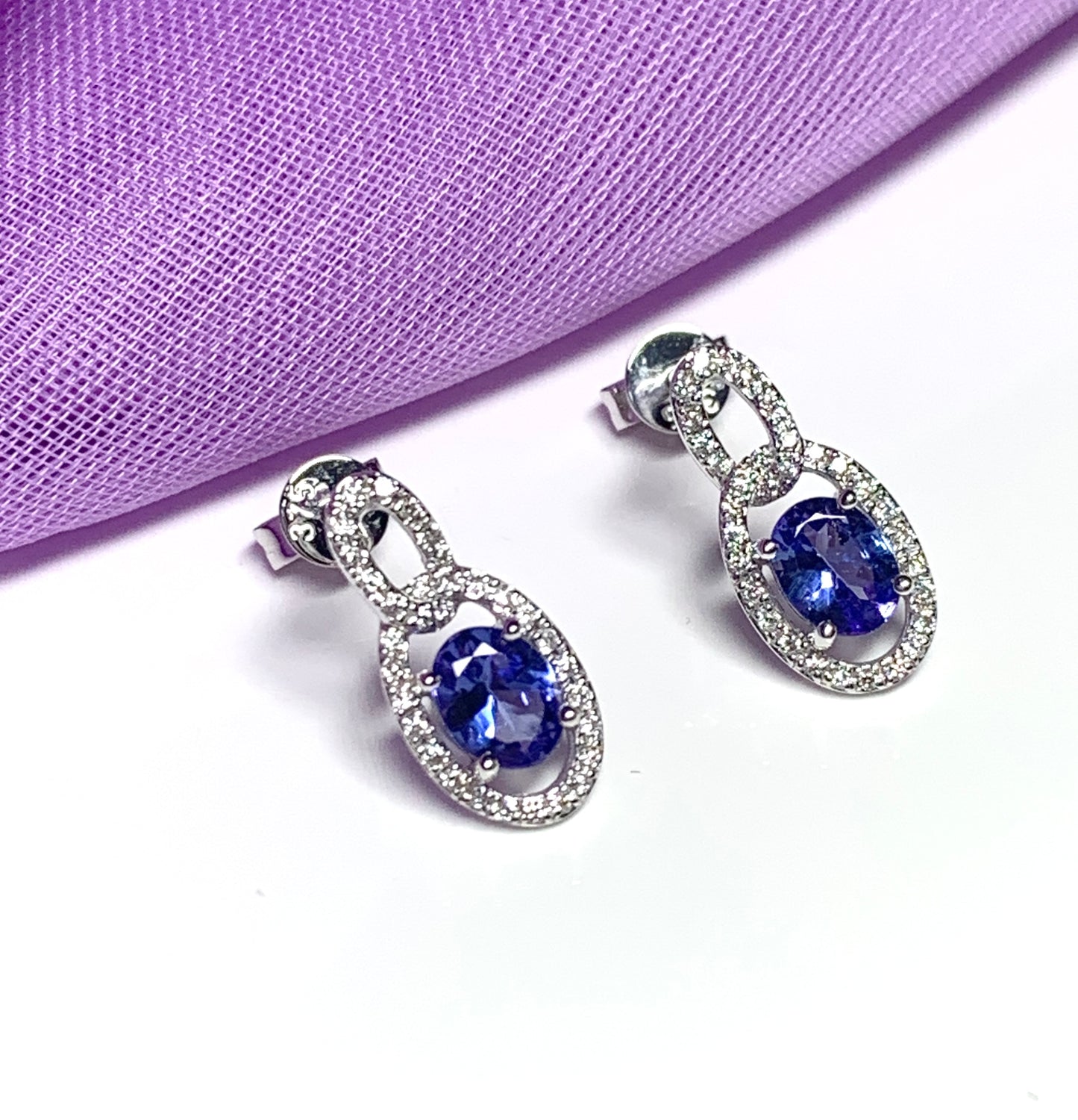 Oval cluster tanzanite and diamond earrings