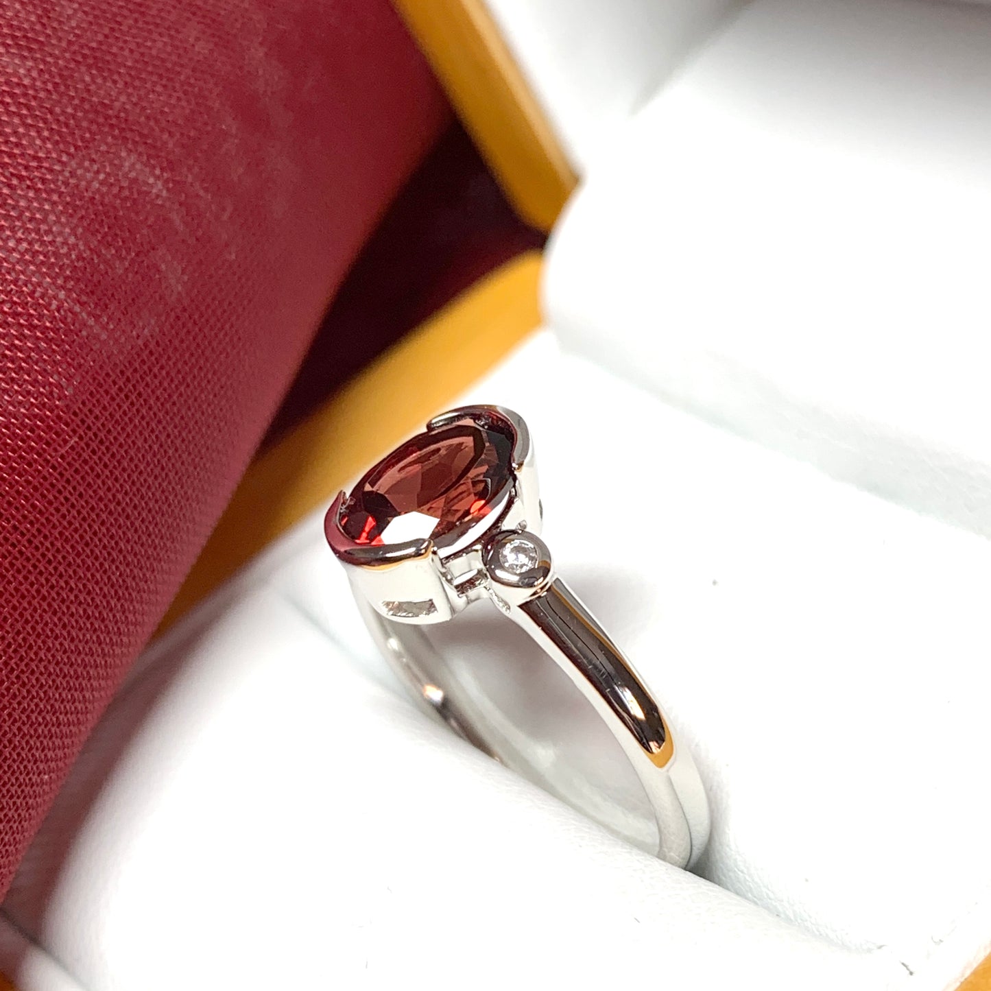 Oval garnet and cubic zirconia sterling silver ring