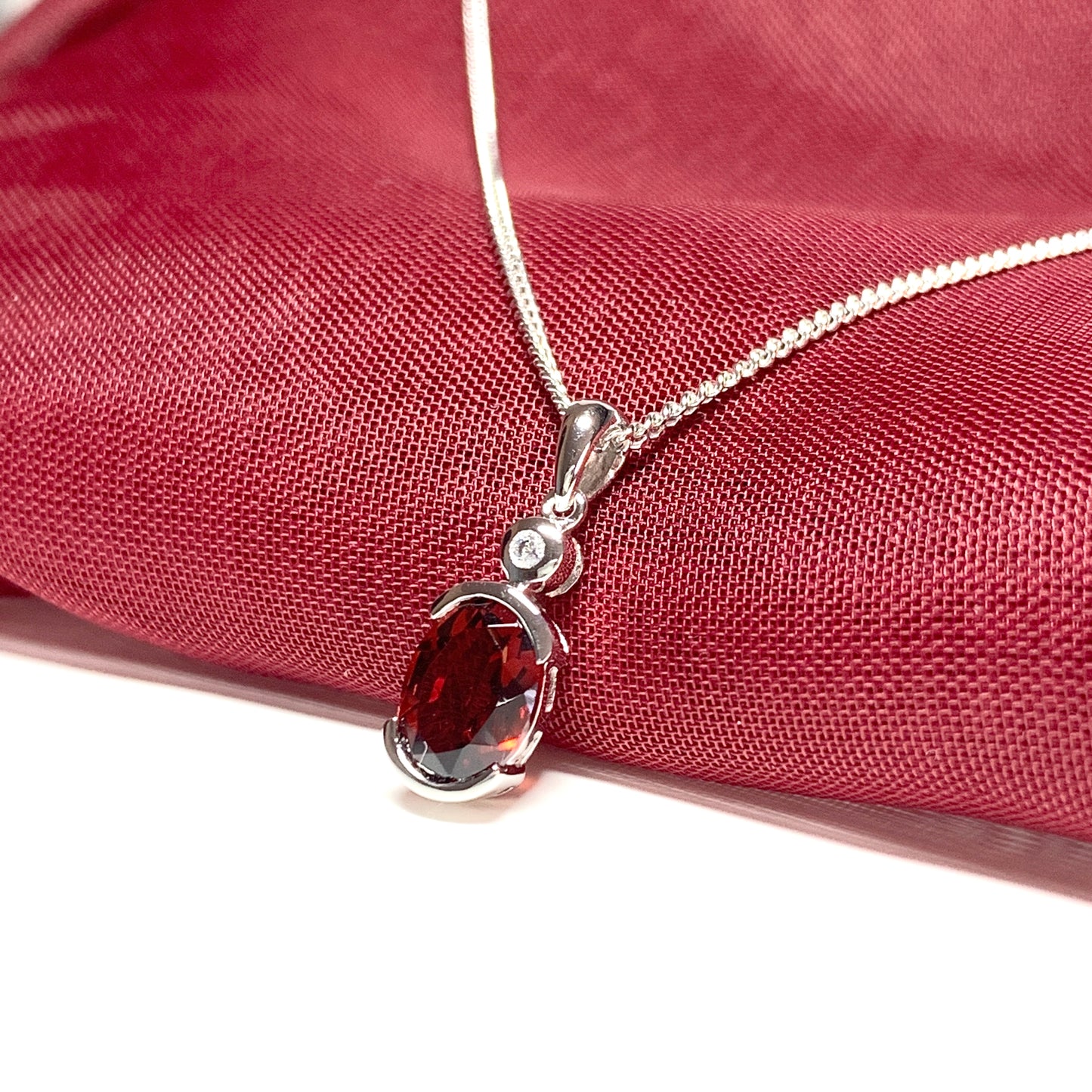 Oval garnet and cubic zirconia sterling silver necklace