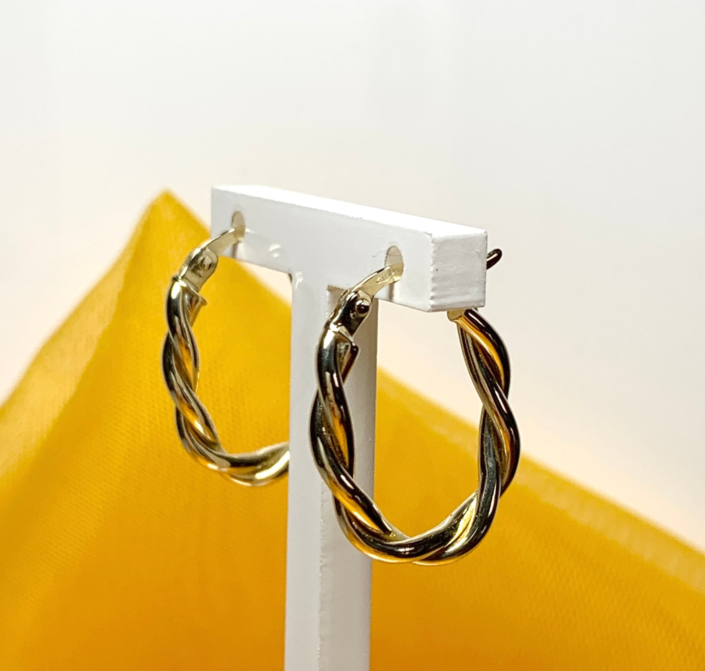 Oval hoop earrings yellow gold twisted