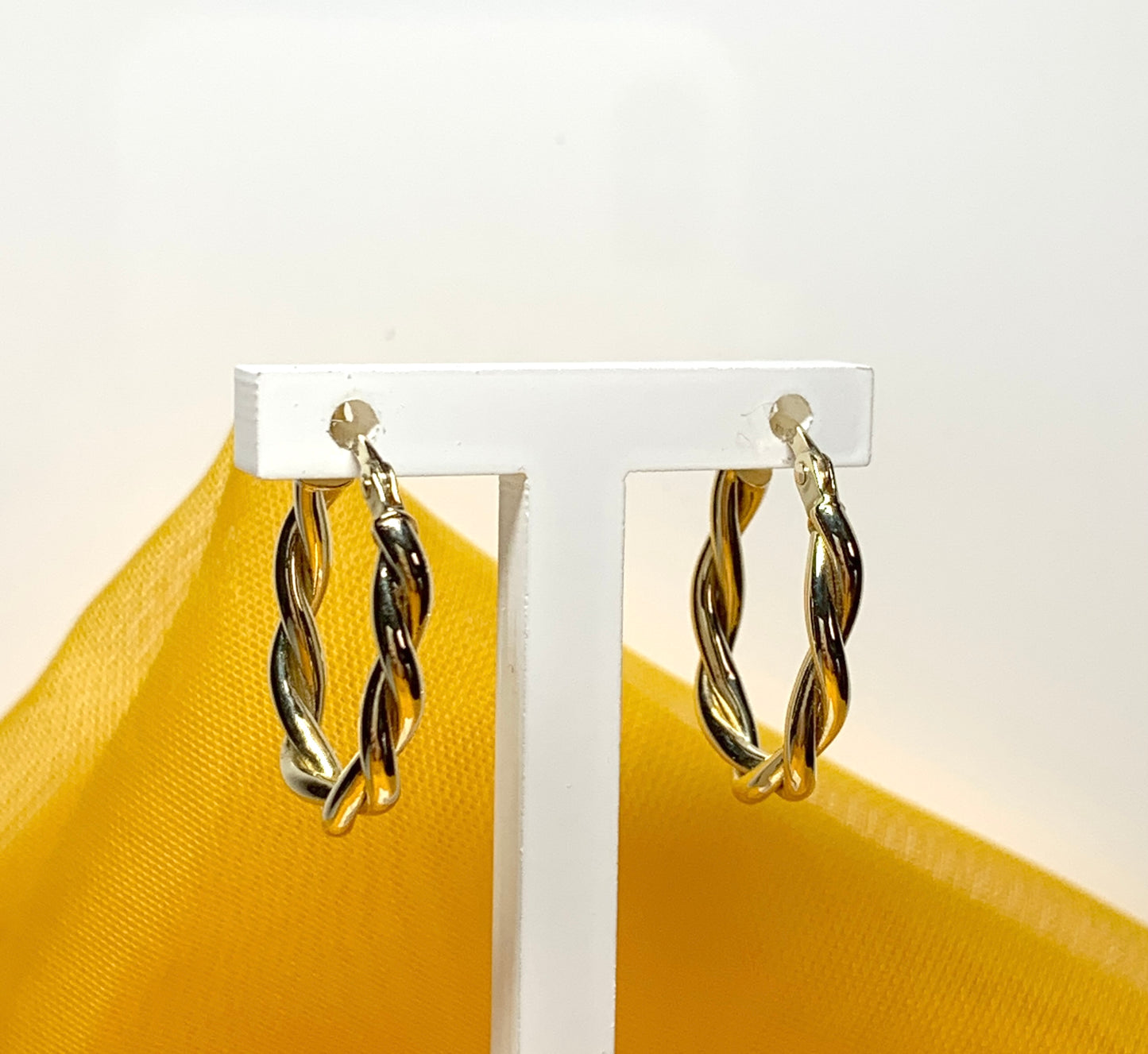 Oval hoop earrings yellow gold twisted