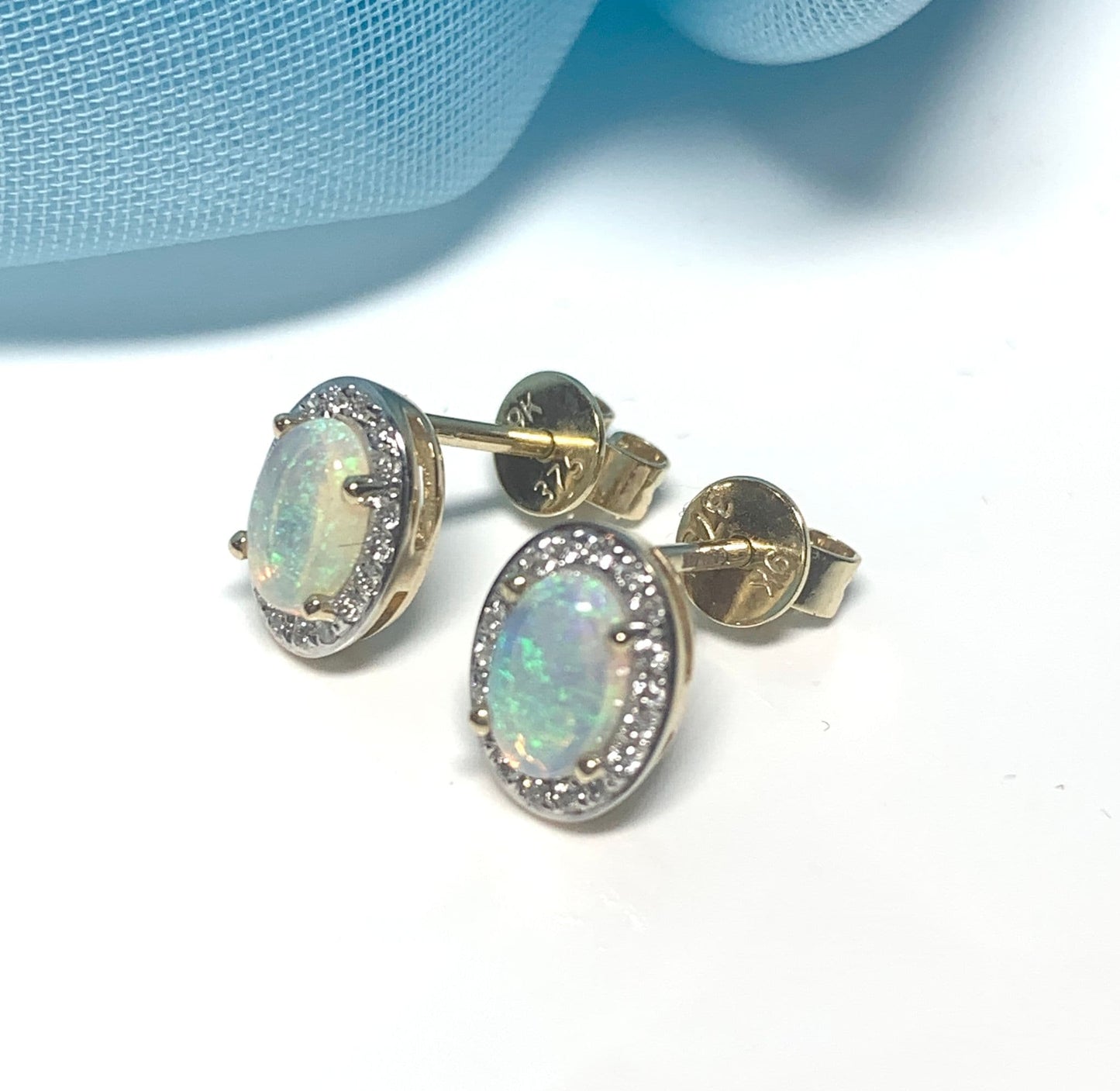 Oval opal and diamond yellow gold stud cluster earrings