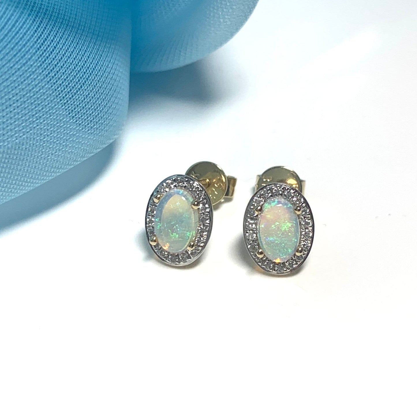 Oval opal and diamond yellow gold stud cluster earrings