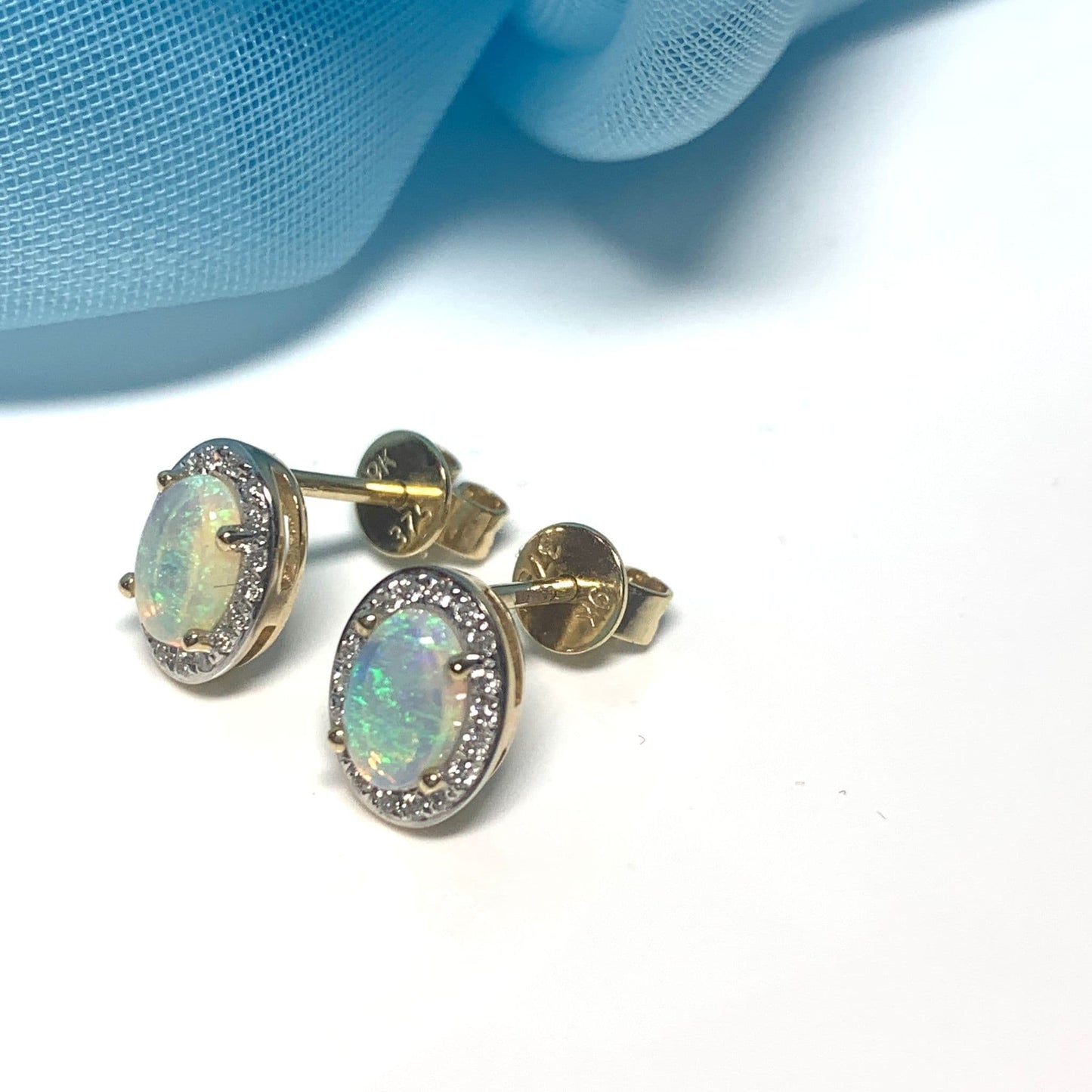 Oval opal and diamond yellow gold stud cluster earrings