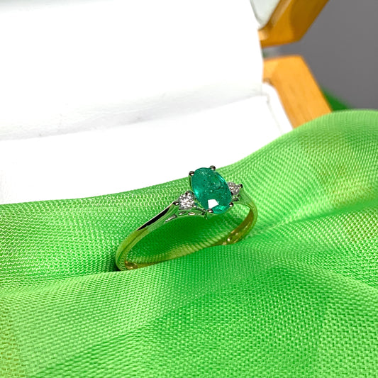 Oval real green emerald and diamond yellow gold trilogy dress ring