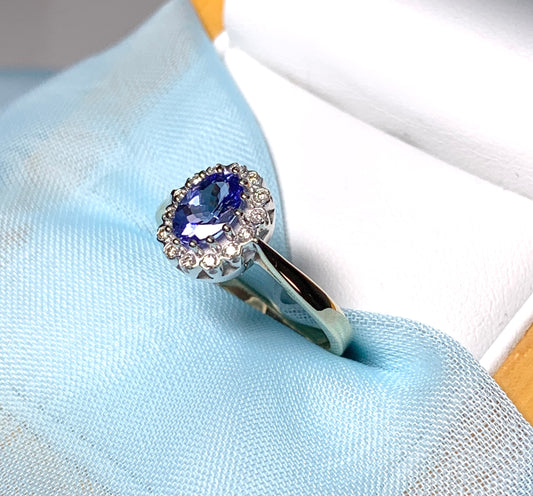 Oval real tanzanite and diamond cluster ring yellow gold