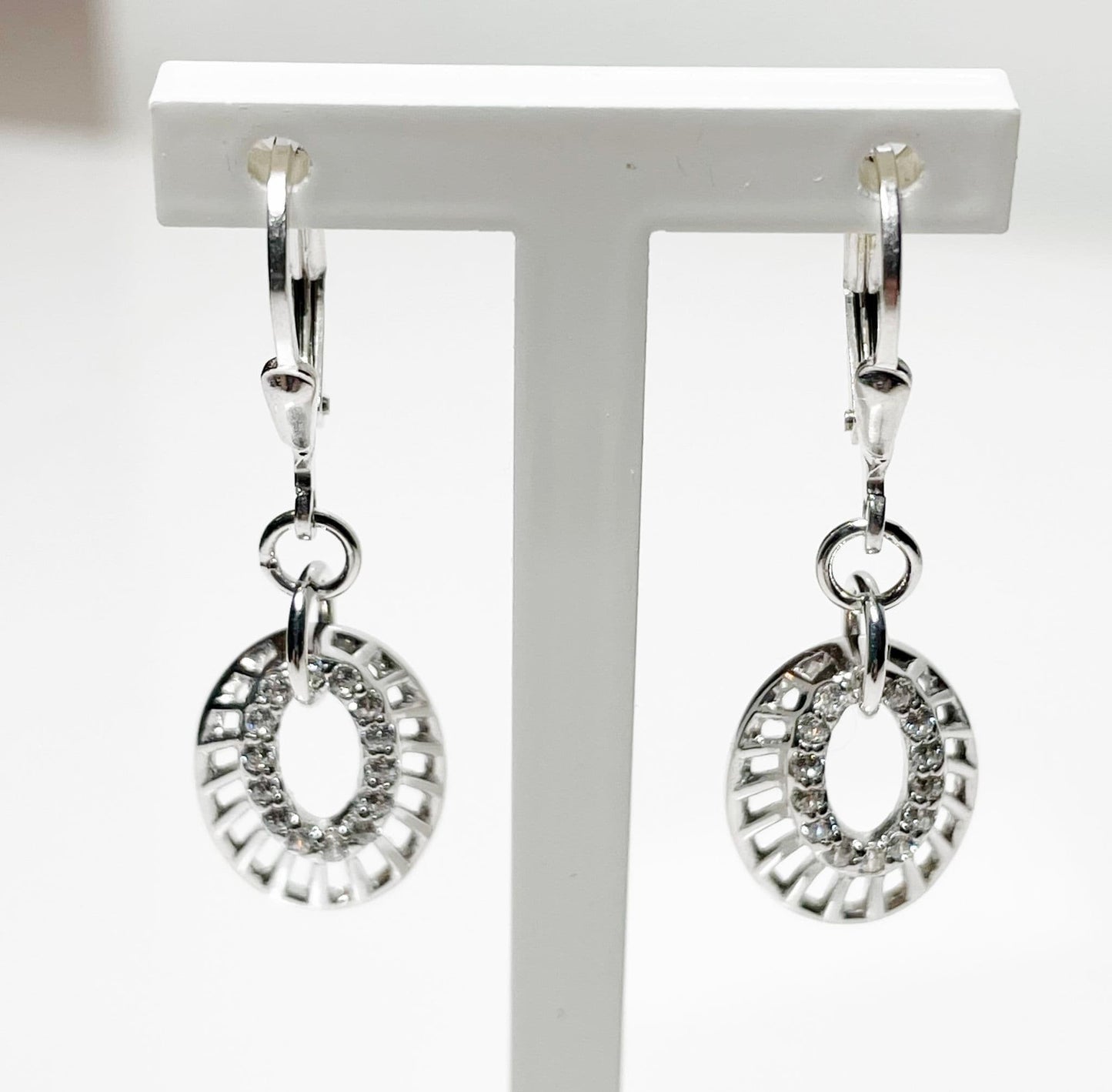 an Oval shaped cubic zirconia sterling silver drop earrings