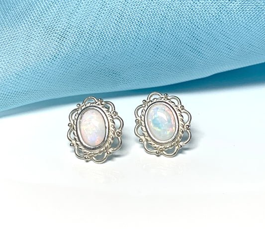 Fancy oval sterling silver opal stud earrings