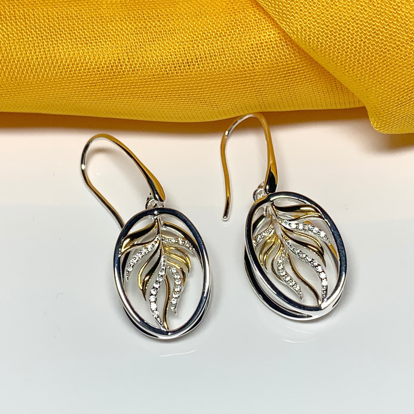 Sterling silver two tone oval drop earrings