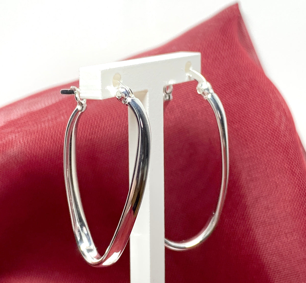 Oval twisted polished hoop earrings sterling silver