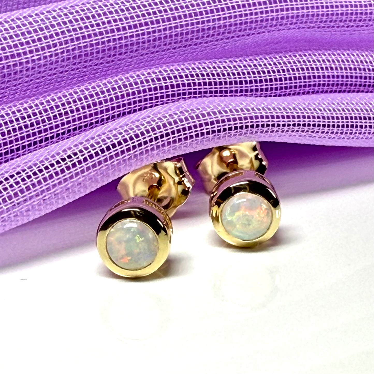 Pair of real opal earrings round yellow gold stud smooth rubbed over setting