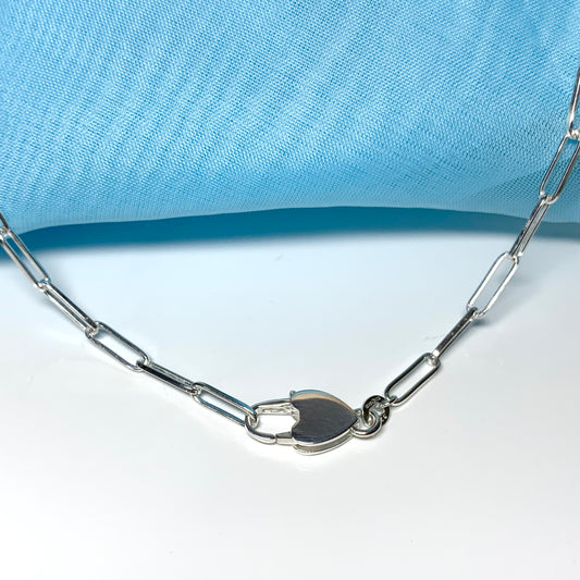 Paper link shaped link sterling silver ladies necklace with large heart lock feature
