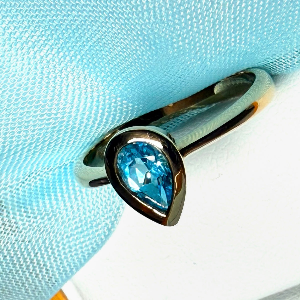 Pear shaped real blue topaz yellow gold dress ring teardrop