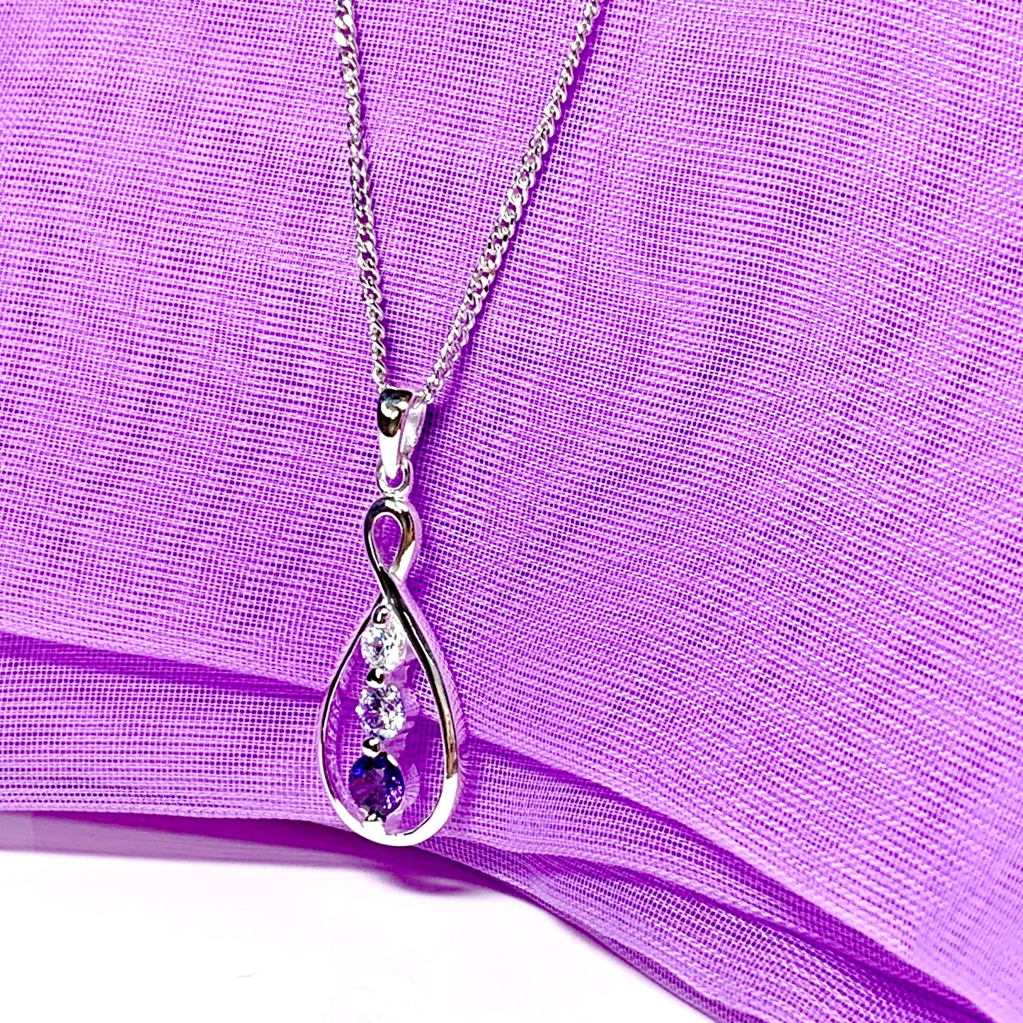 Pear shaped open pierced drop necklace sterling silver sparkling polished purple cubic zirconia