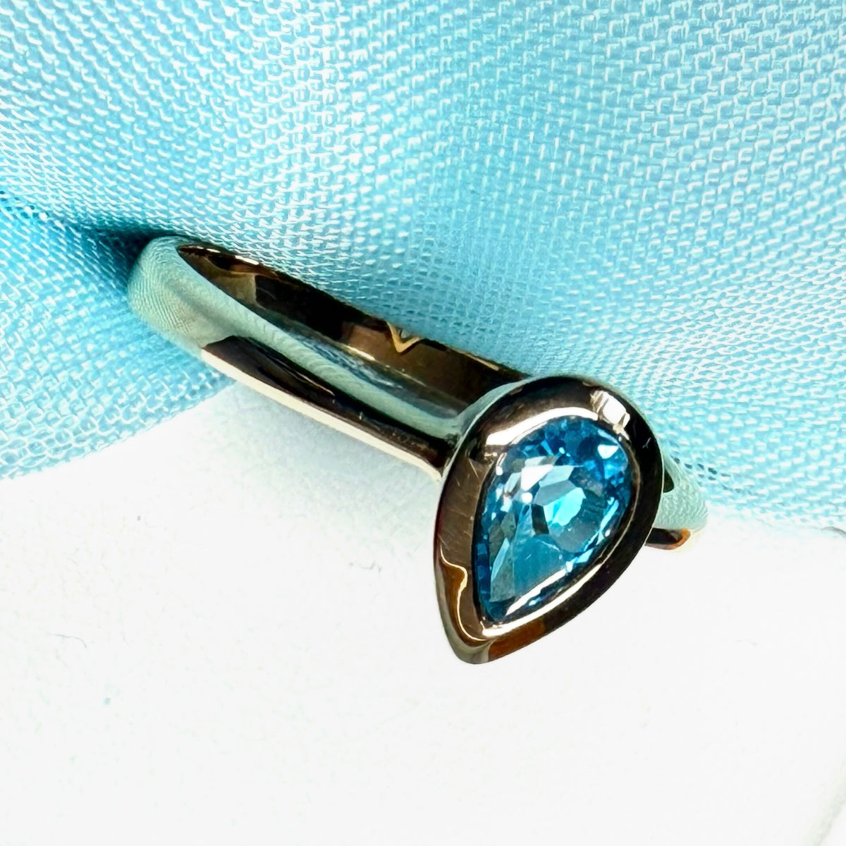 Pear shaped real blue topaz yellow gold dress ring teardrop
