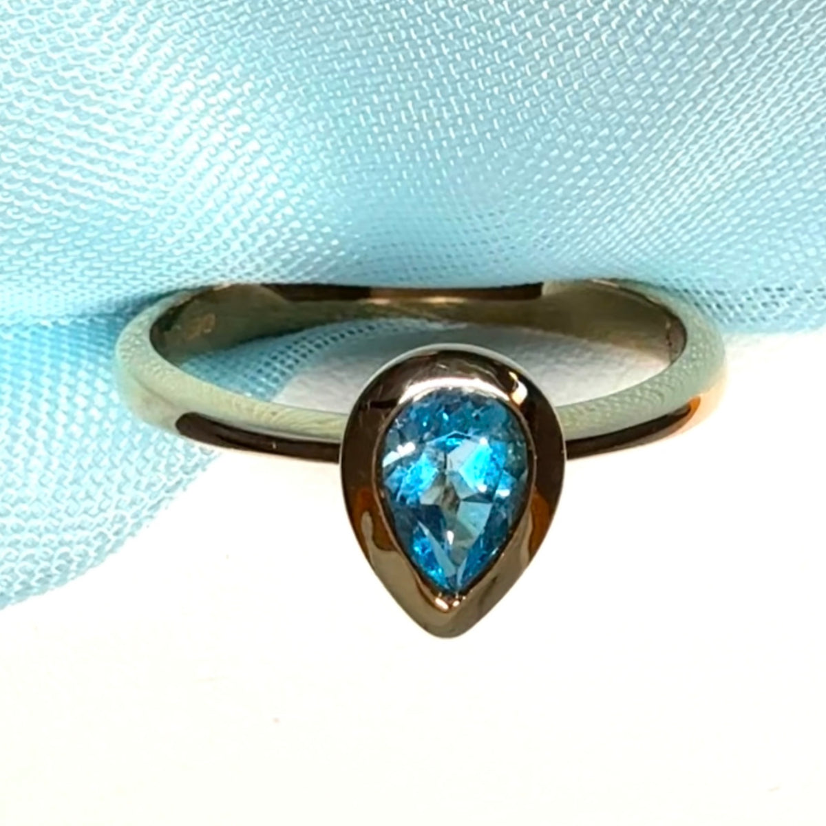 Pear shaped real blue topaz yellow gold dress ring teardrop
