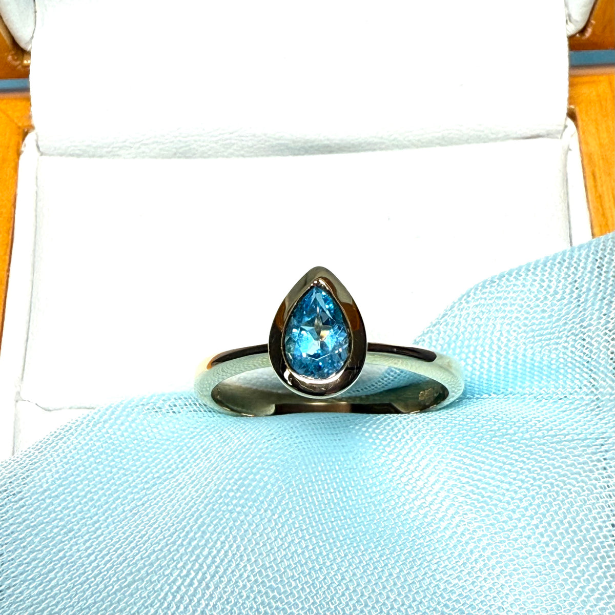 Pear shaped real blue topaz yellow gold dress ring teardrop