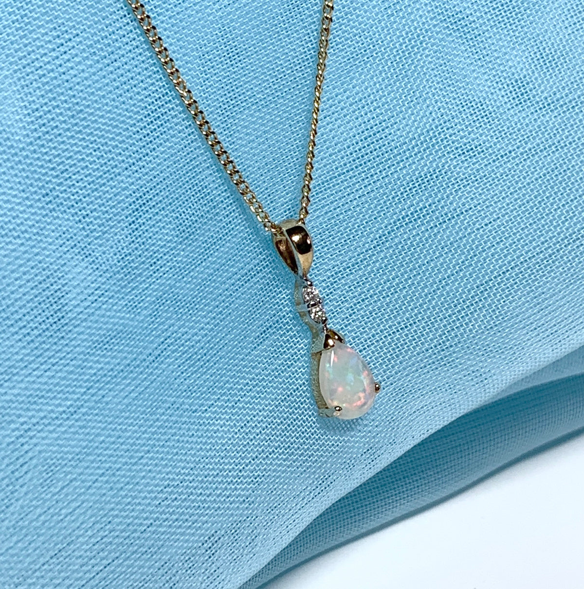 Pear shaped real opal and diamond yellow gold necklace