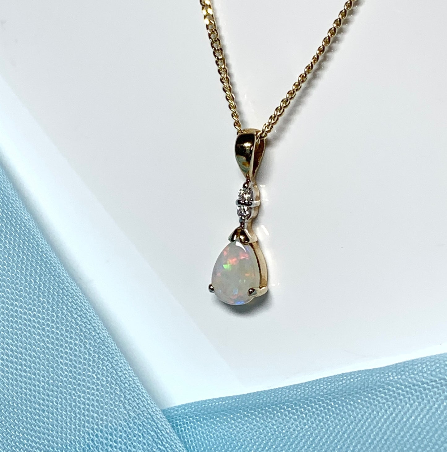 Pear shaped real opal and diamond yellow gold necklace