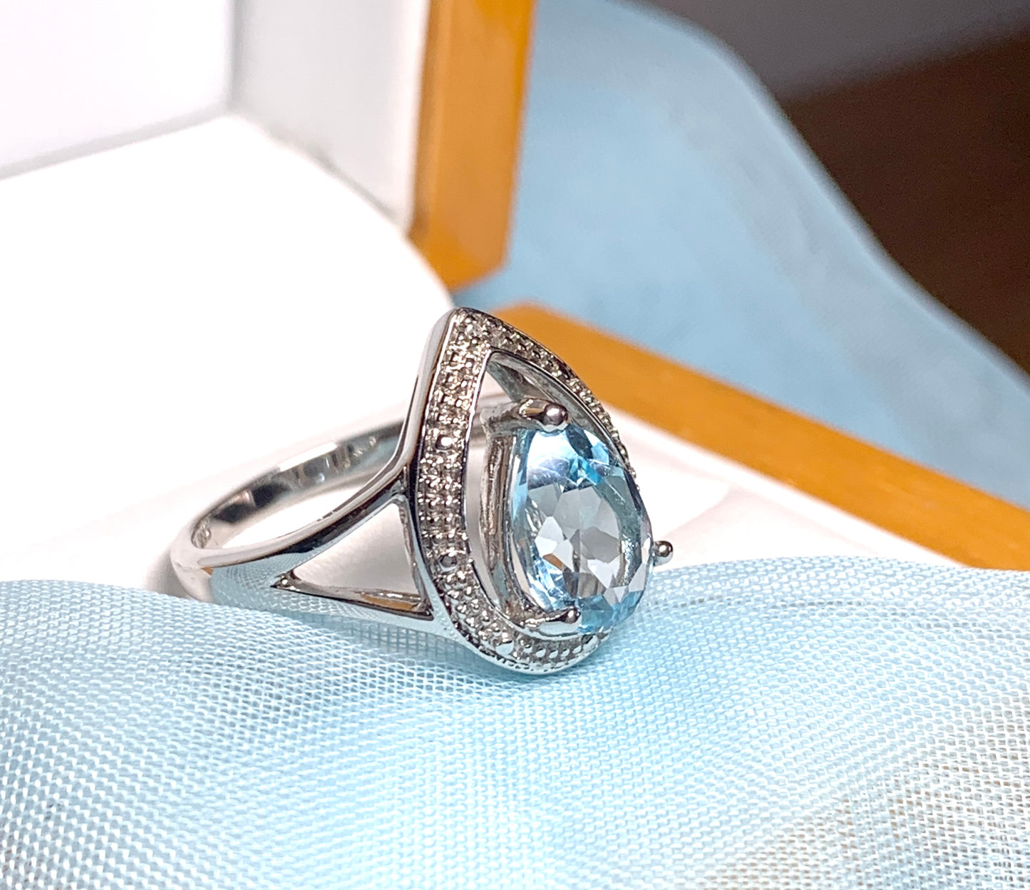 Pear shaped blue topaz sterling silver cluster ring