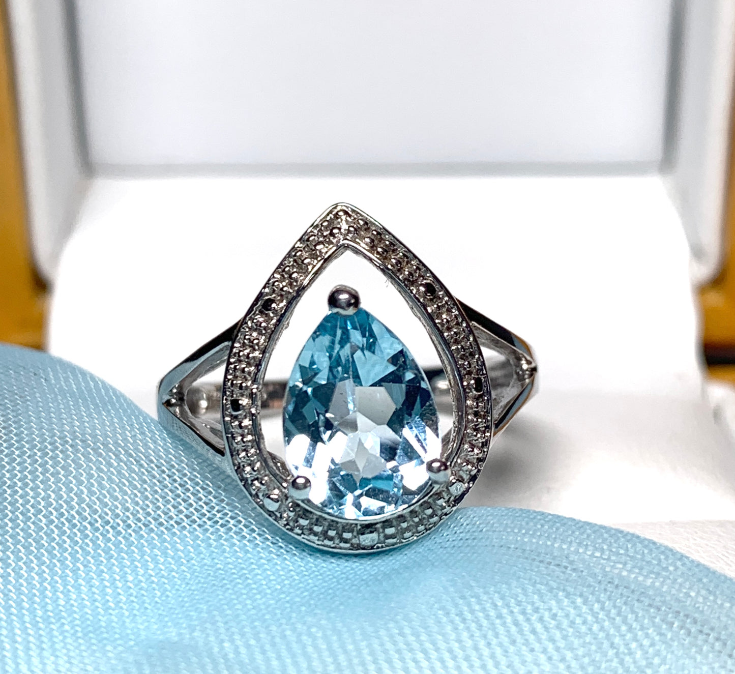 Pear shaped blue topaz sterling silver cluster ring