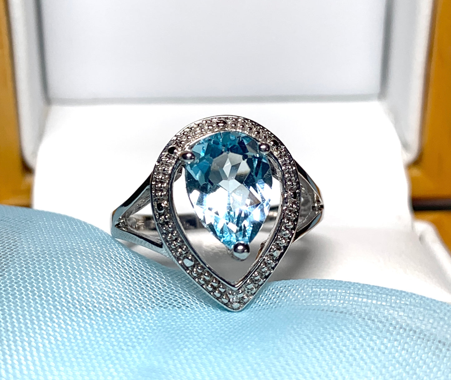 Pear shaped blue topaz sterling silver cluster ring