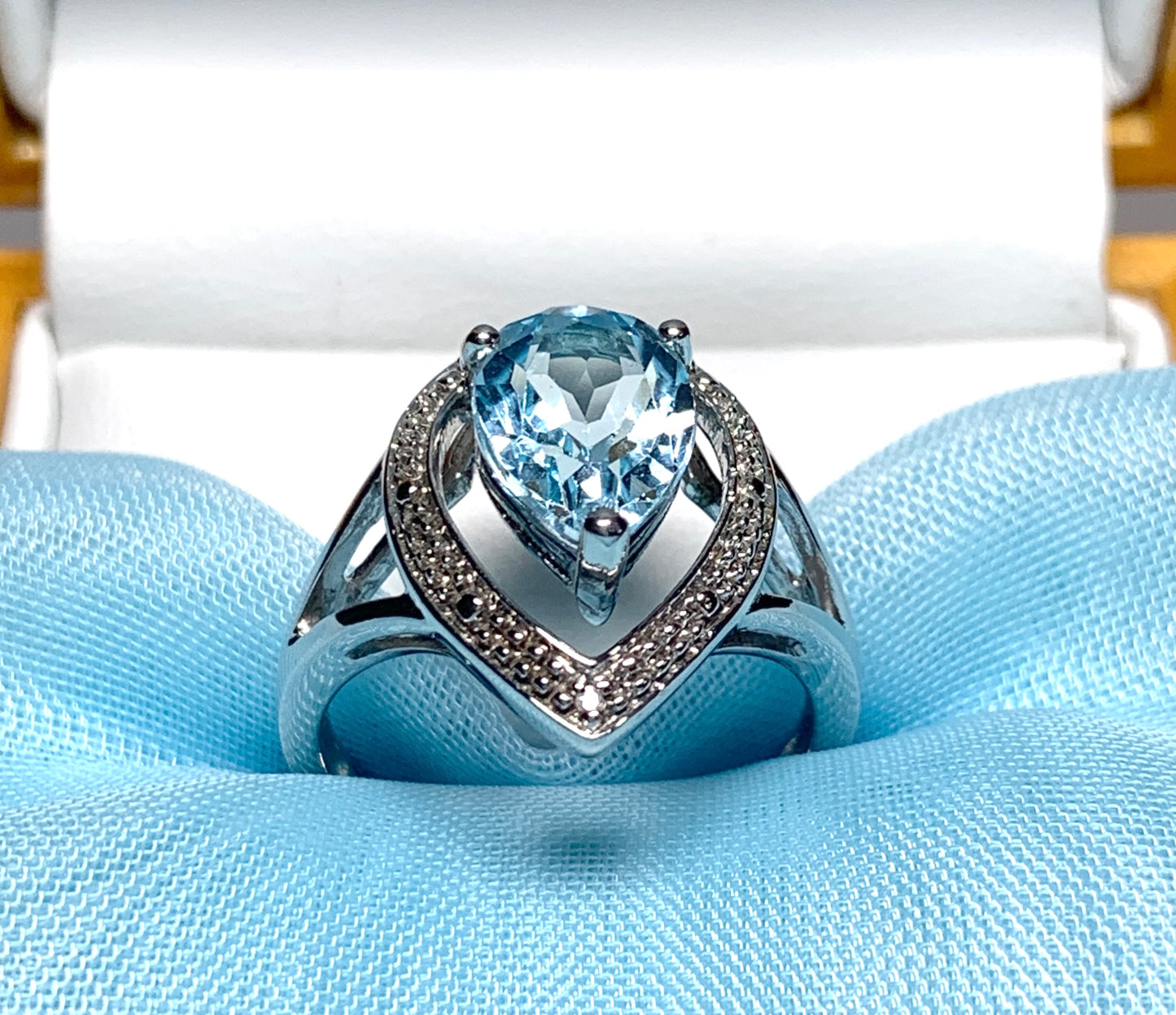 Pear shaped blue topaz sterling silver cluster ring