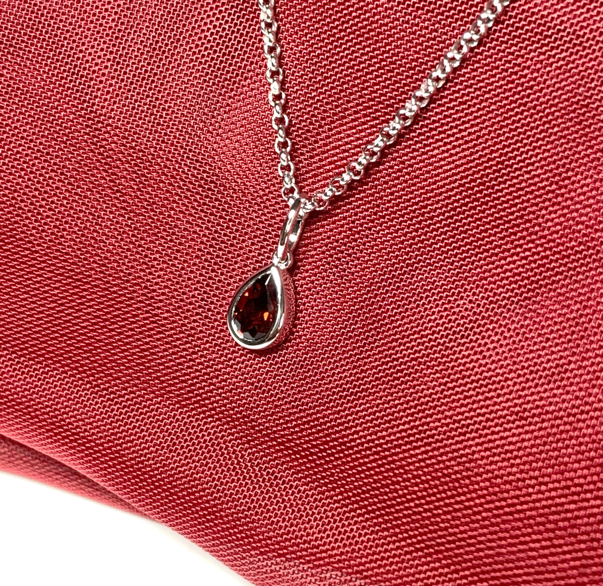 Pear shaped necklace set with a real red garnet stone sterling silver including chain