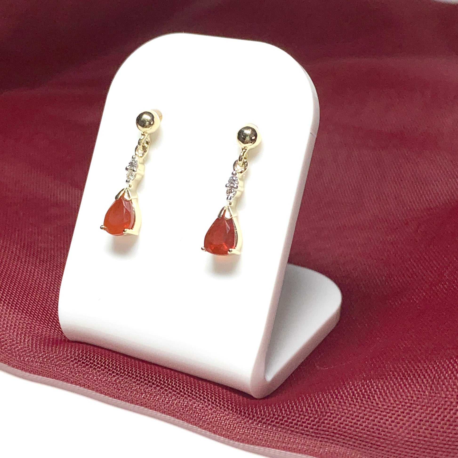 Pear shaped orange real fire opal and diamond drop earrings yellow gold