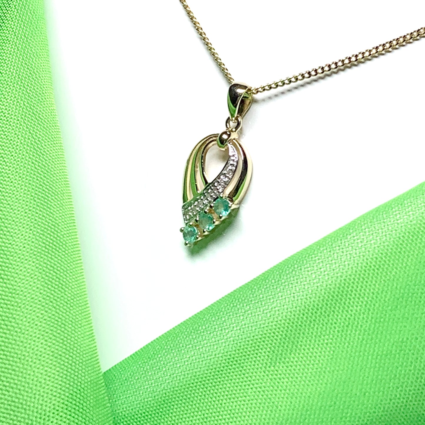 Pear shaped real green emerald and diamond spray necklace yellow gold