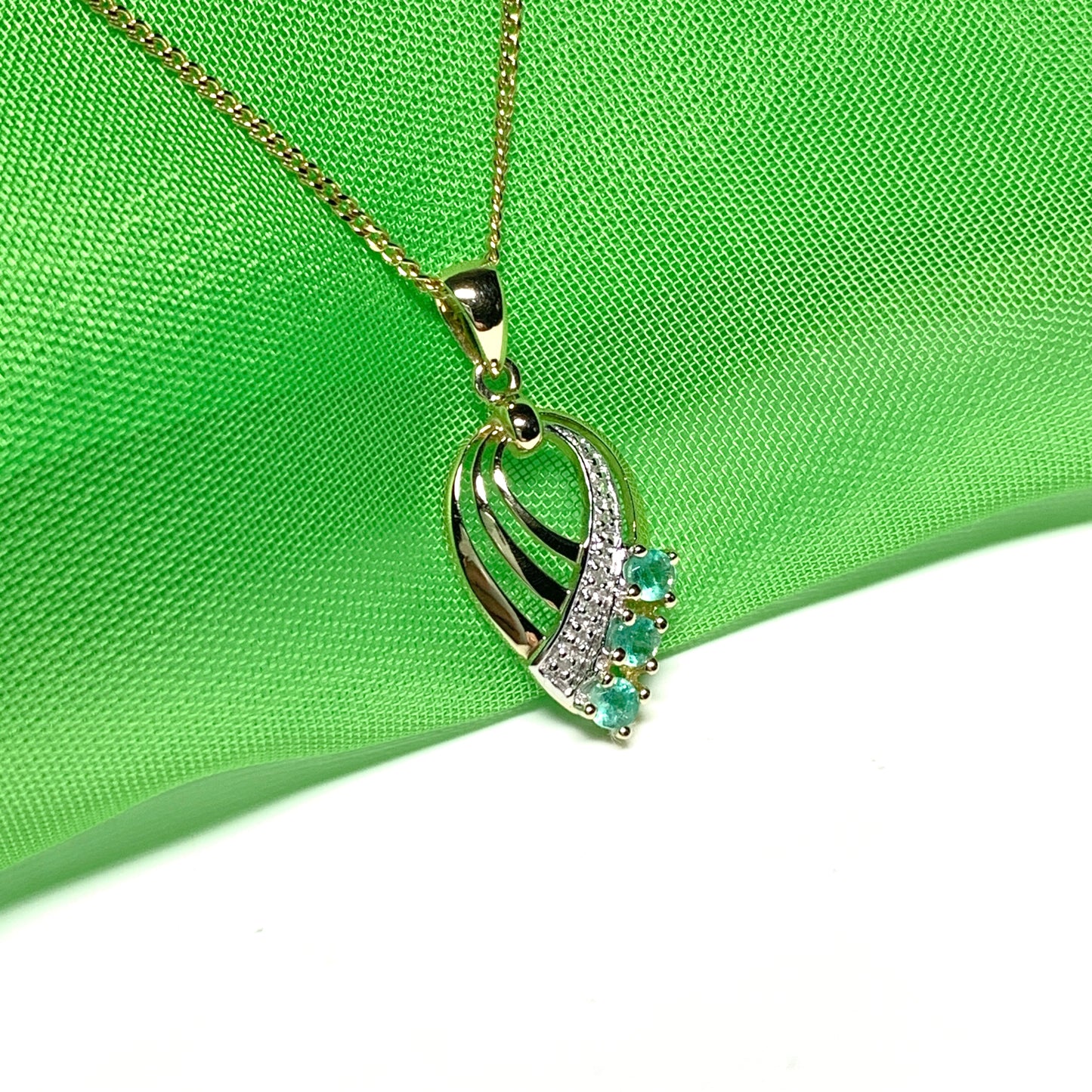 Pear shaped real green emerald and diamond spray necklace yellow gold