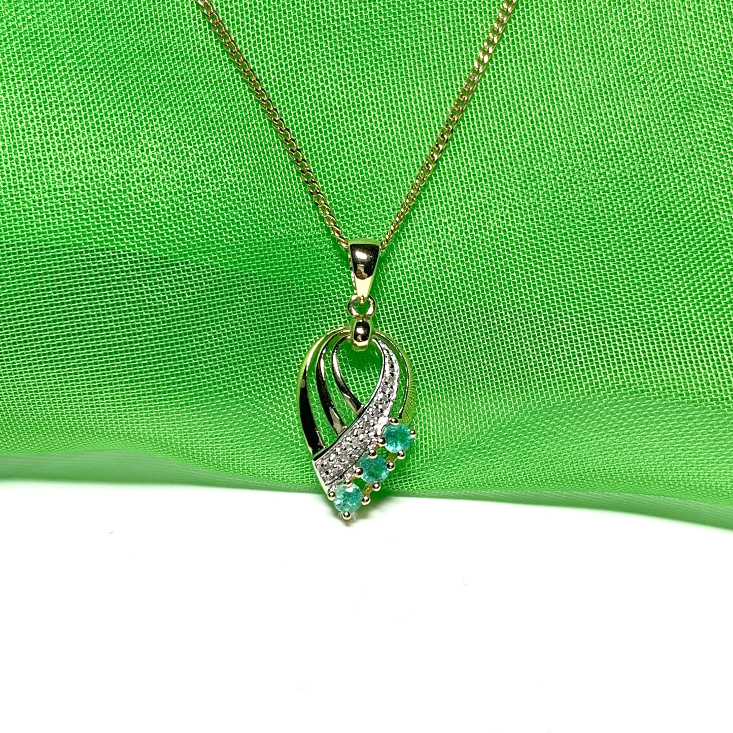 Pear shaped real green emerald and diamond spray necklace yellow gold