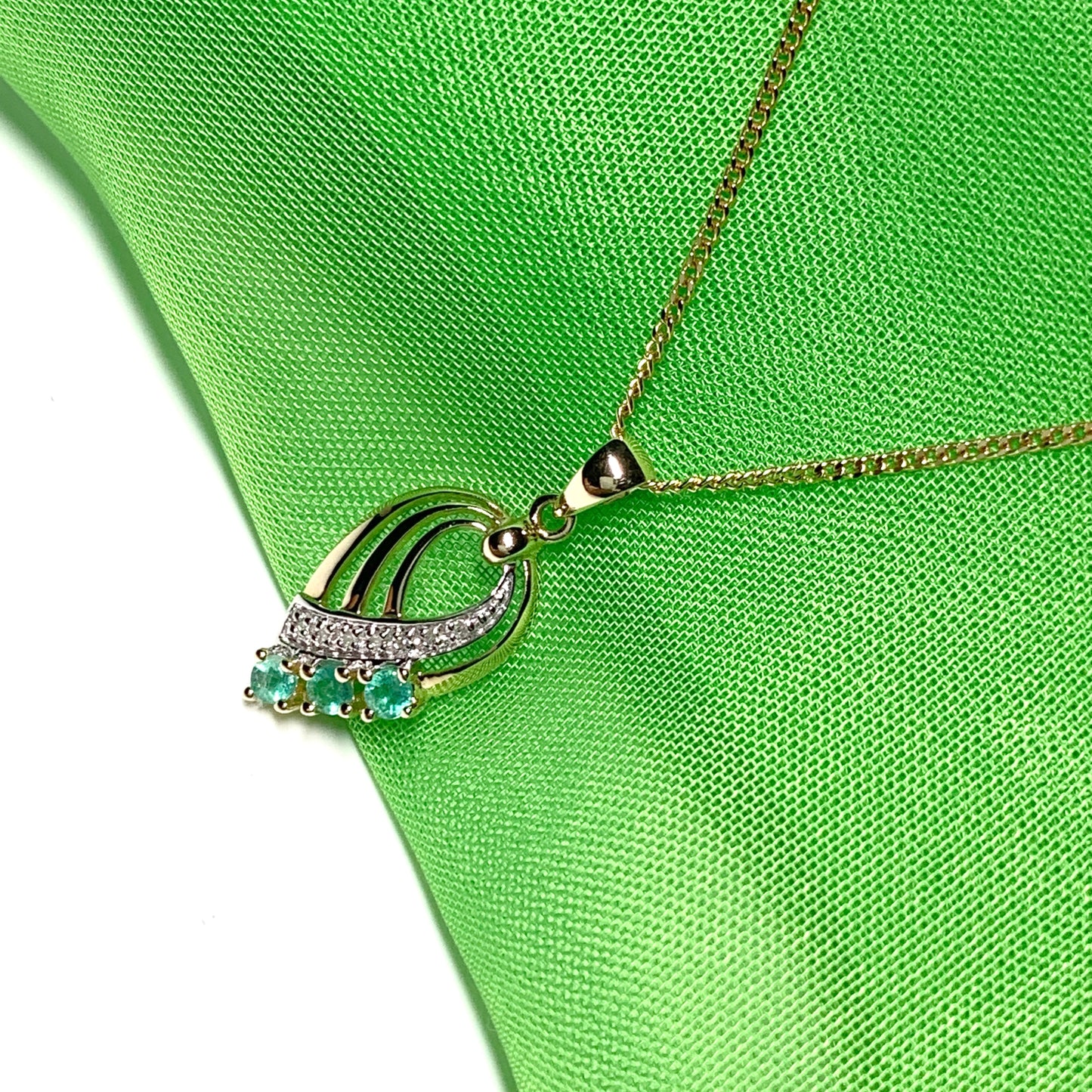 Pear shaped real green emerald and diamond spray necklace yellow gold