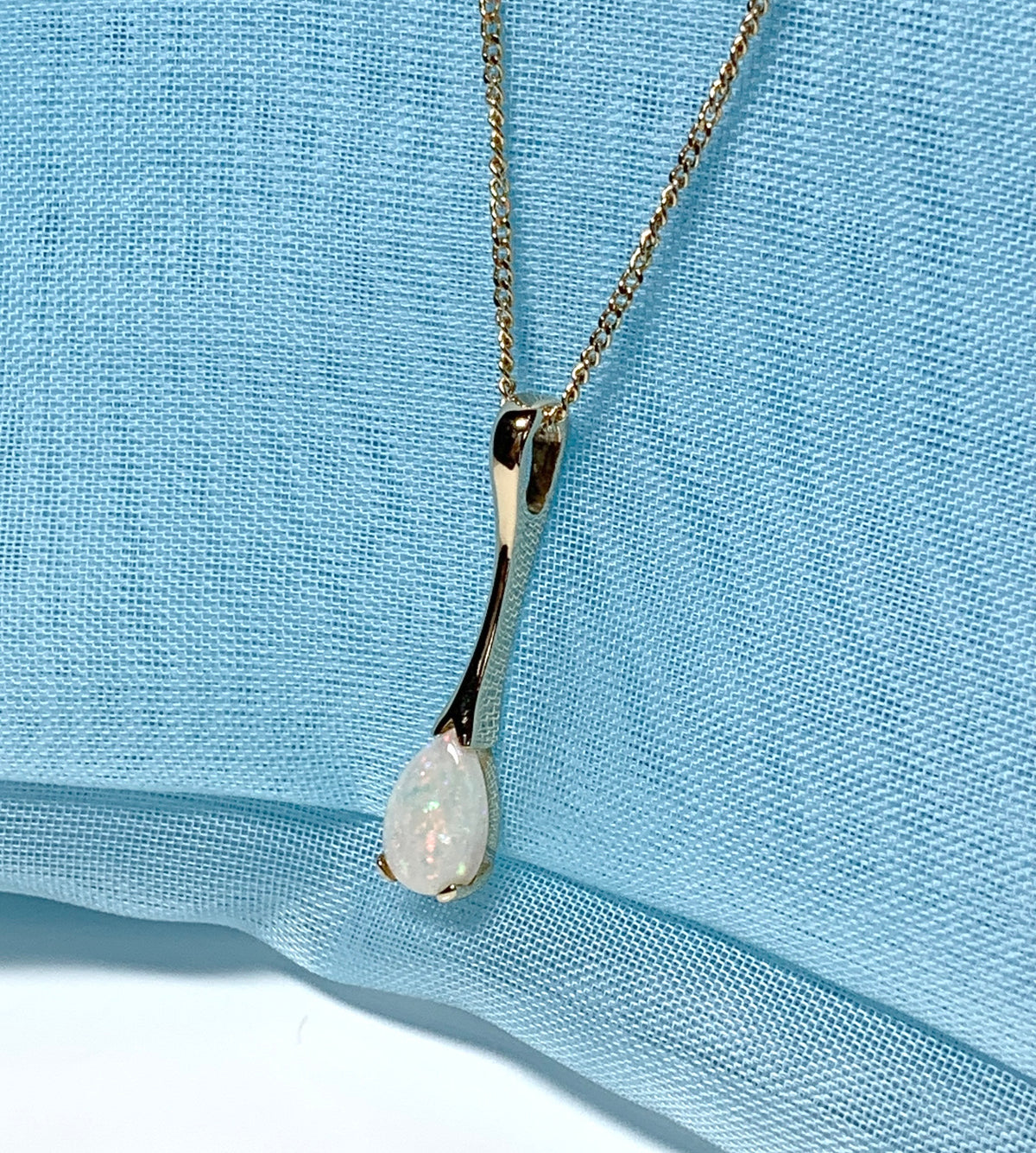 Pear shaped real opal yellow gold long necklace pendant