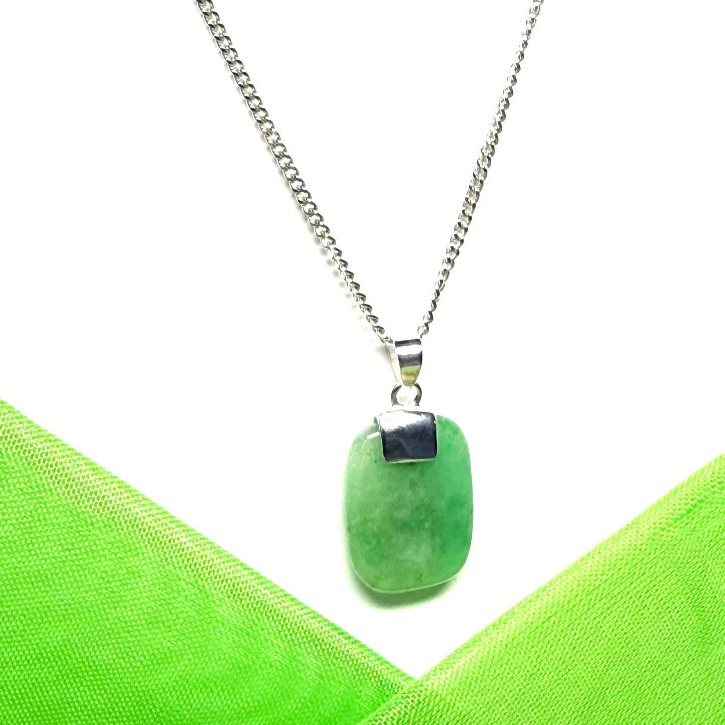 Pendant necklace having a real green jade stone sterling silver cushion shaped with a chain