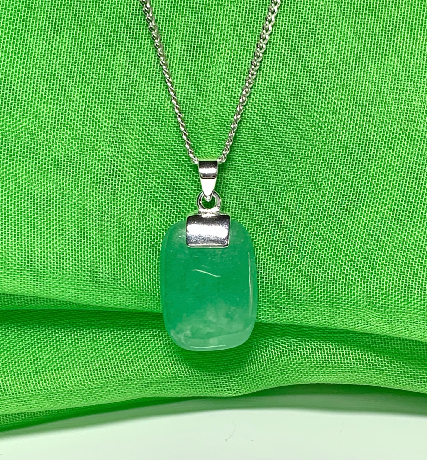 Pendant necklace having a real green jade sterling silver cushion shaped
