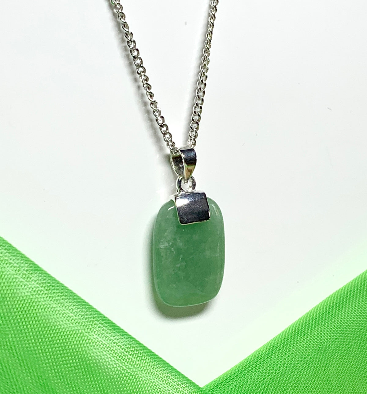 Pendant necklace with a real green jade sterling silver cushion shaped