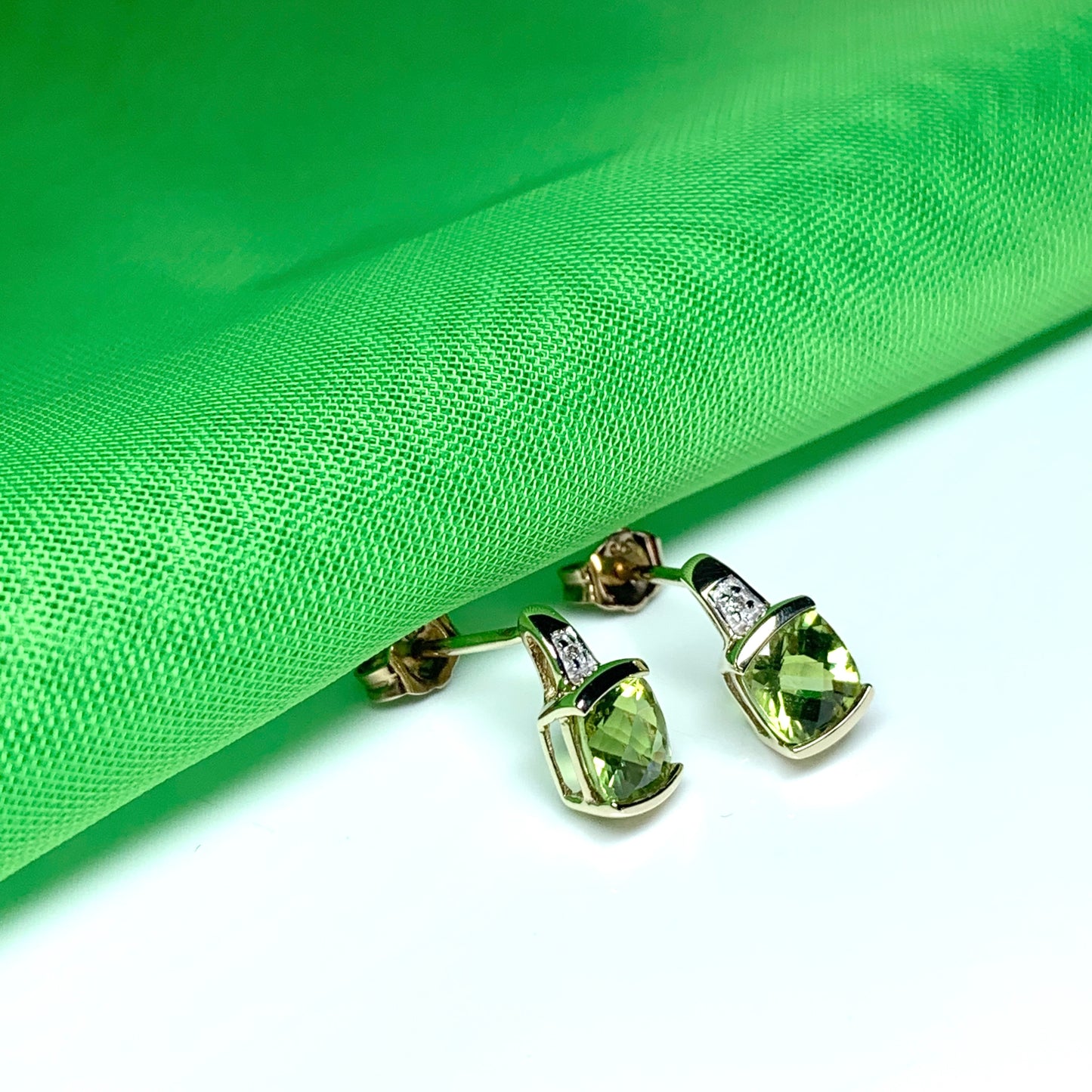 Peridot and diamond yellow gold cushion shaped earrings