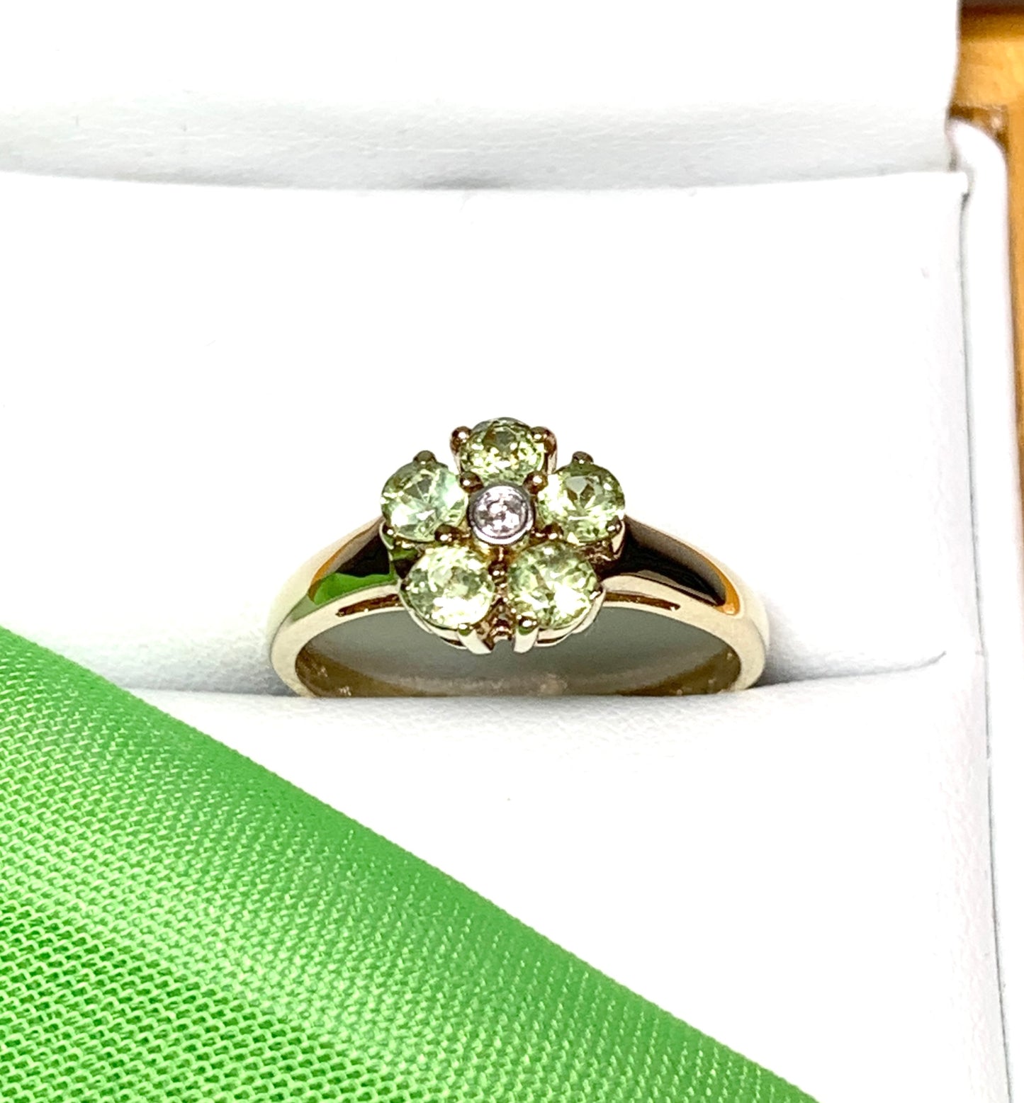 Peridot and diamond yellow gold daisy cluster ring