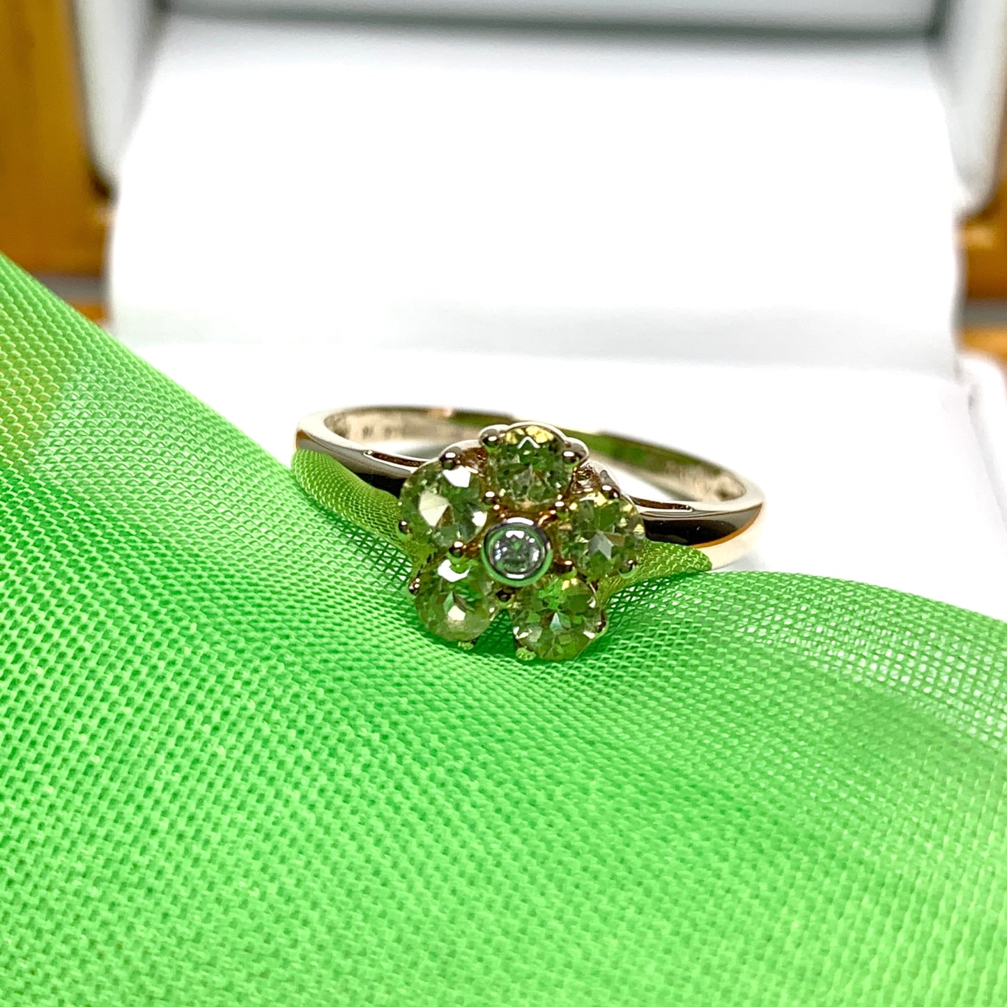 Peridot and diamond yellow gold daisy cluster ring