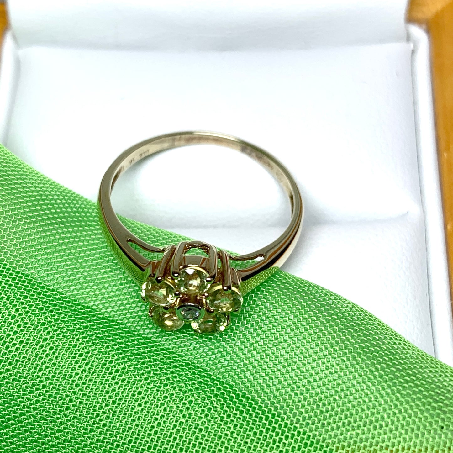 Peridot and diamond yellow gold daisy cluster ring